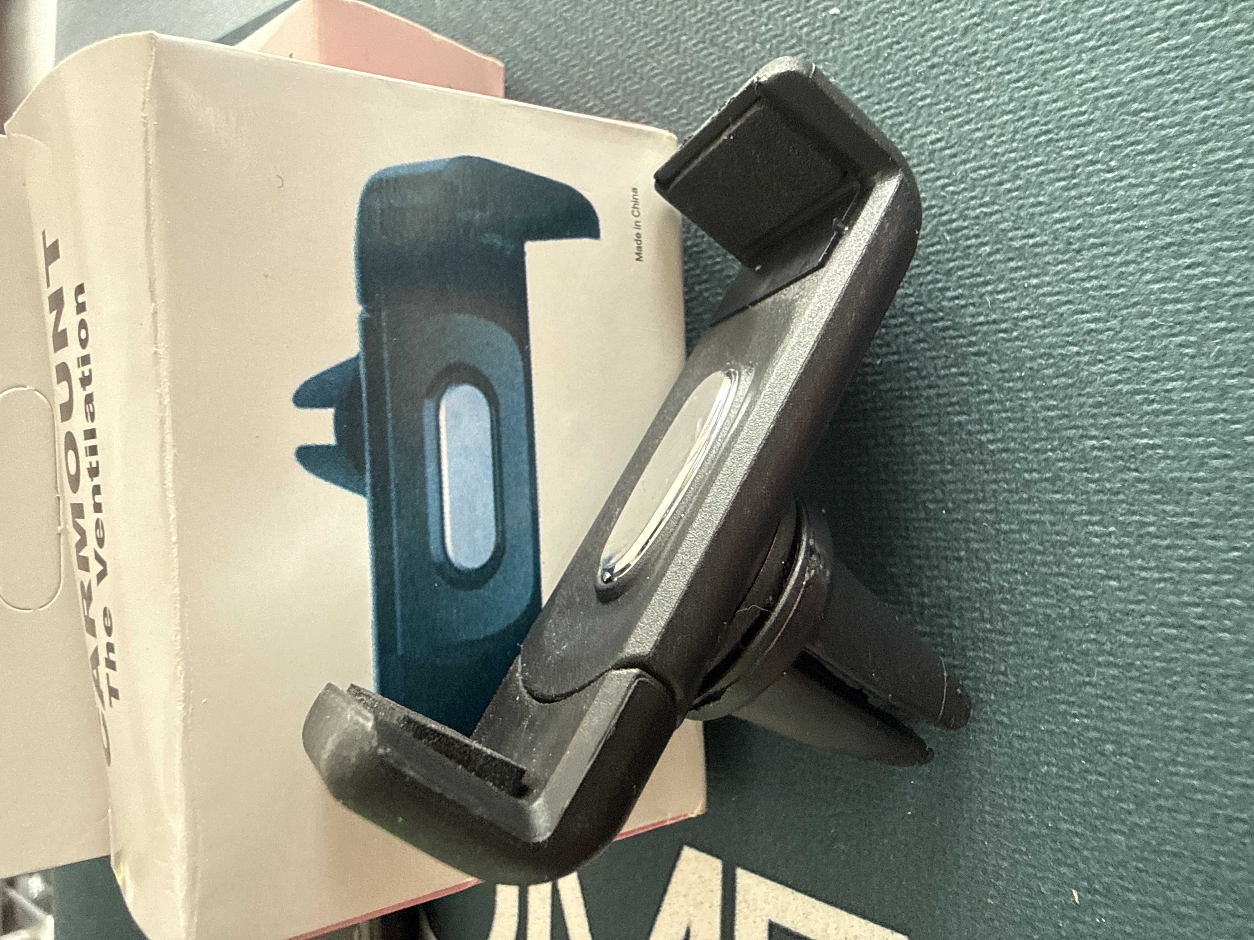 Soporte celular para rejilla de carro